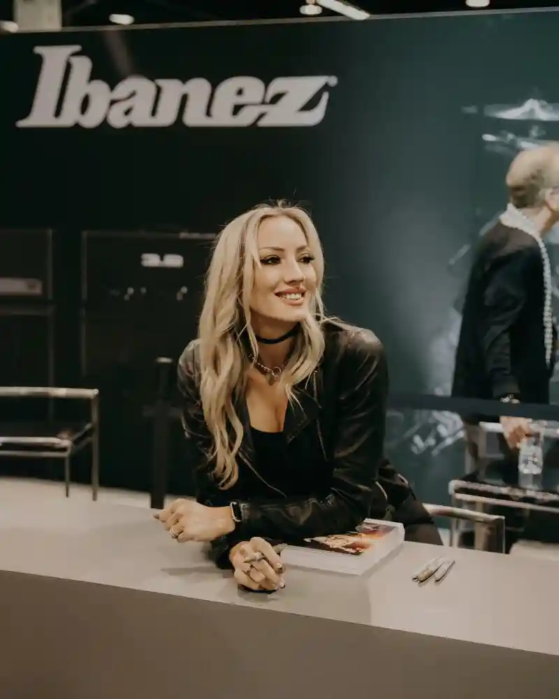 Nita Strauss close-up portrait with long blonde hair