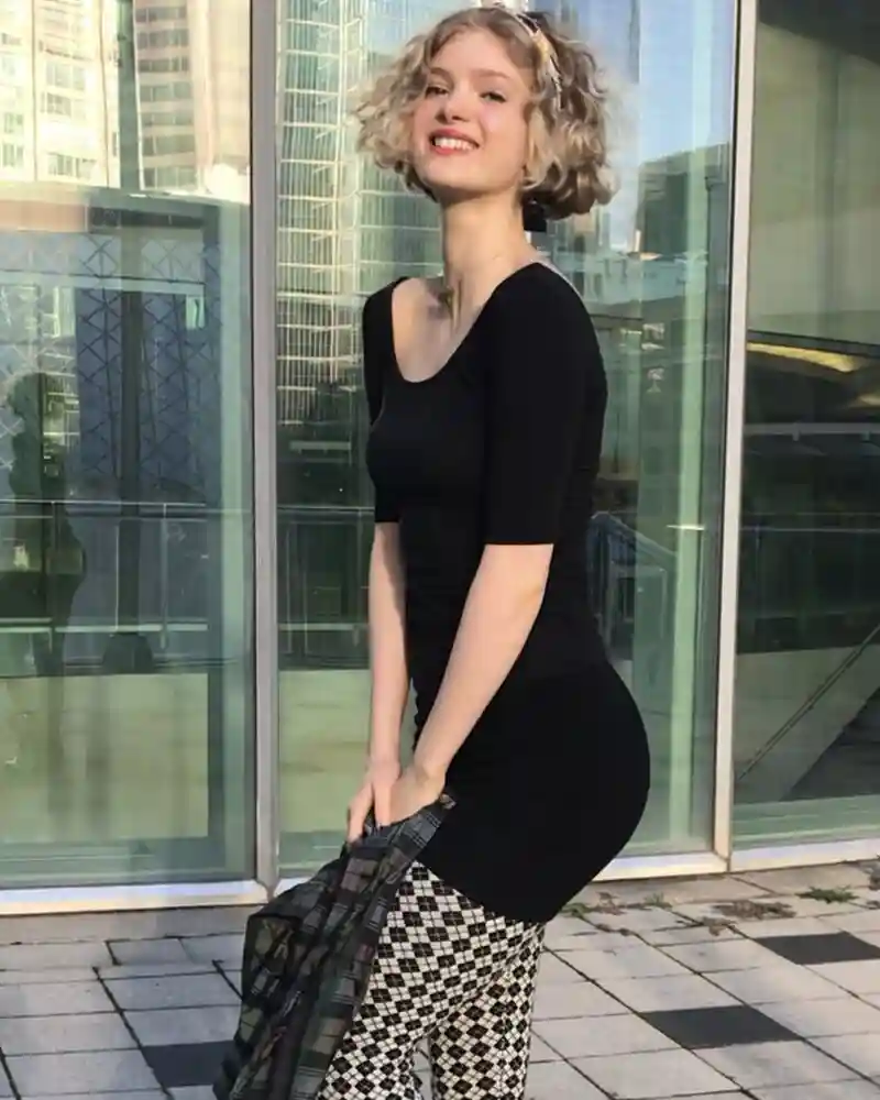 Elena Kampouris attending a Hollywood event in a stylish dress